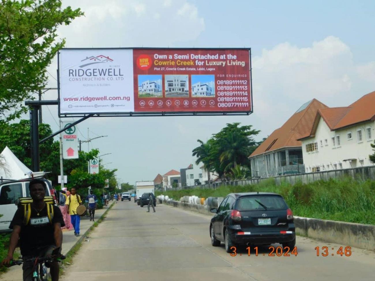 DOUBLE-SIDED GANTRY BILLBOARD BY SPAR ENTRANCE, NICON TOWN LEKKI